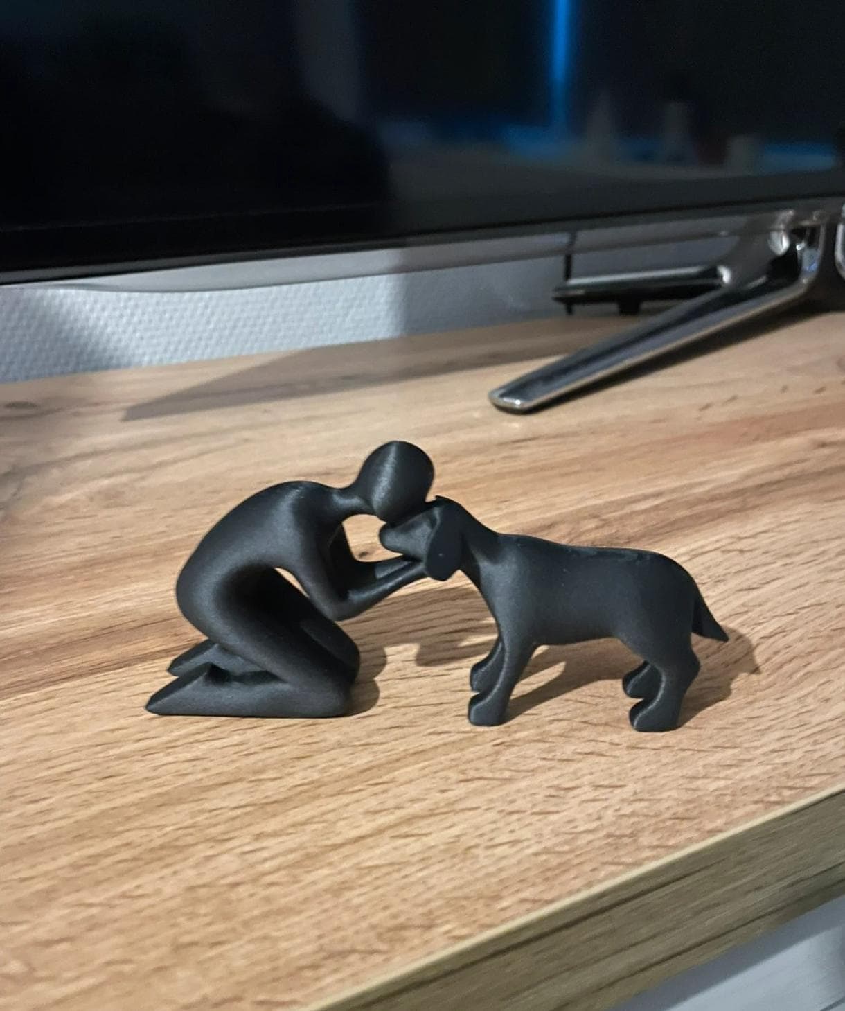 Figur des Besitzers mit Hund