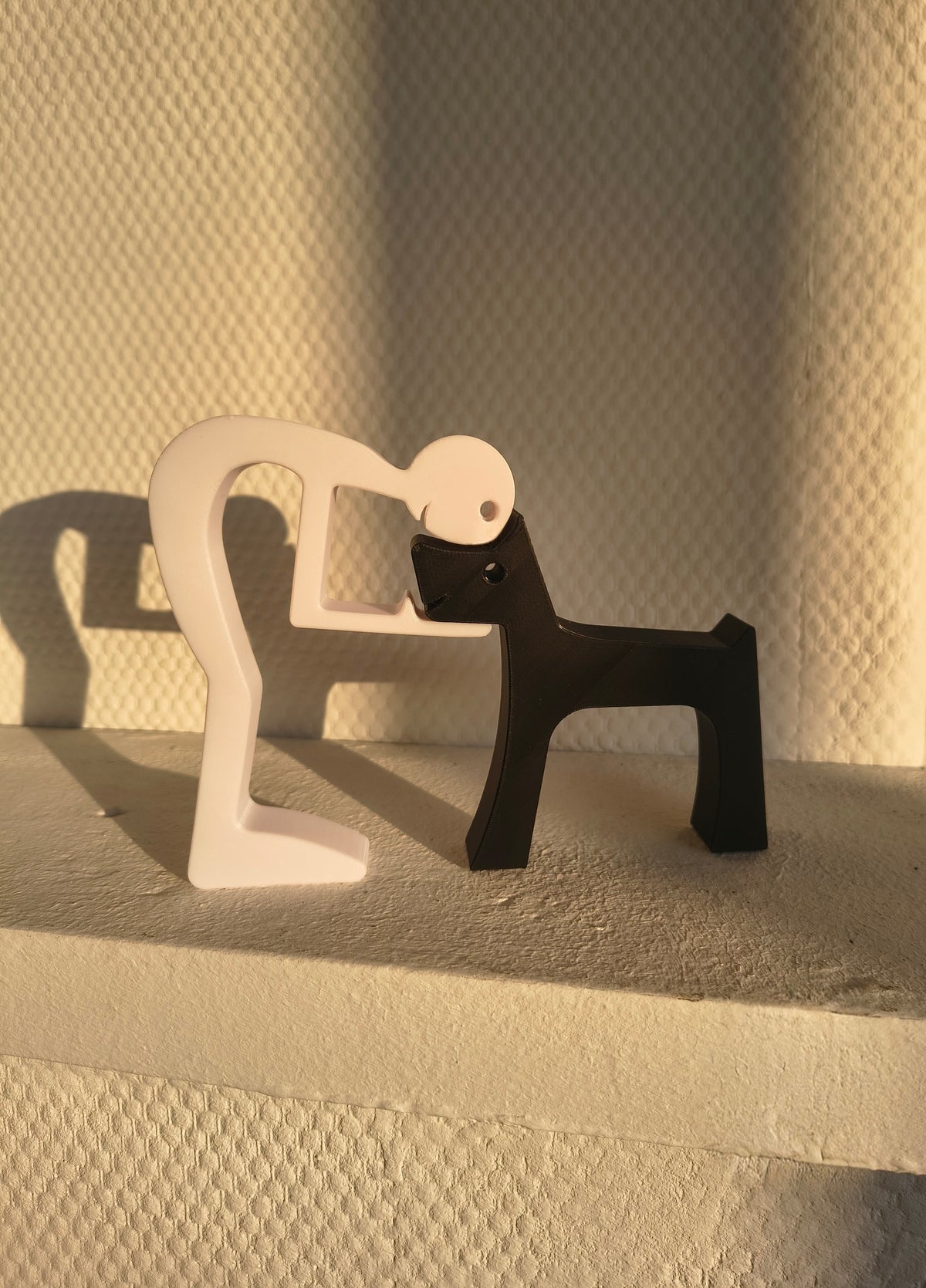 Puzzlefigur des Besitzers mit Hund